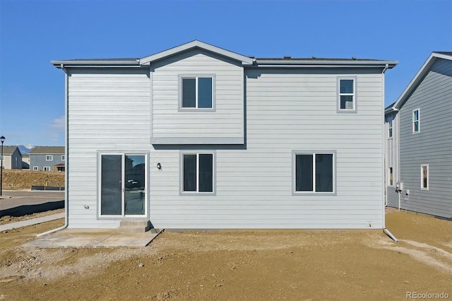 rear view of property with a patio area