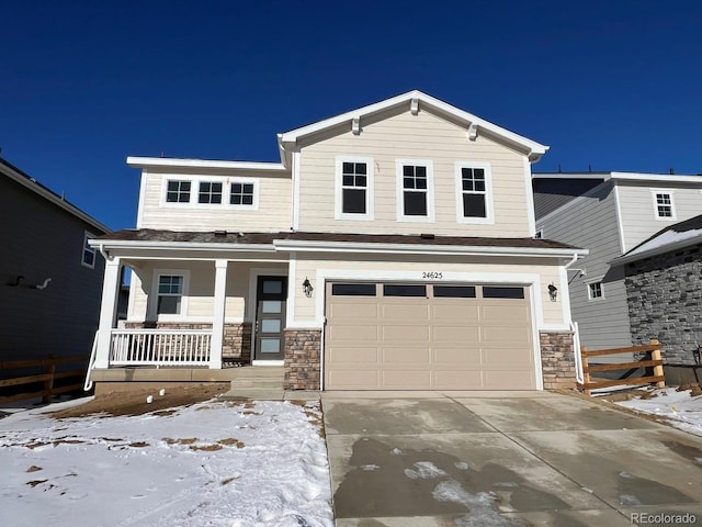 view of front facade featuring covered porch and a garage