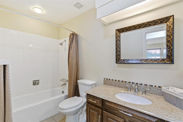 full bathroom featuring toilet, tile patterned floors, vanity, visible vents, and shower / tub combo with curtain