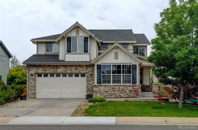 1995 E 166th Ave, Thornton, CO 80602 - craftsman house with board and batten siding, brick siding, an attached garage, driveway, and a front yard