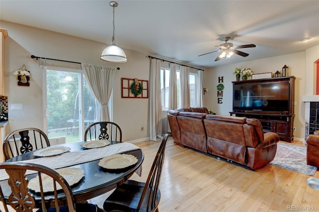 1995 E 166th Ave, Thornton, CO 80602 - dining area featuring ceiling fan, plenty of natural light, light wood-type flooring, and baseboards
