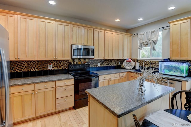 1995 E 166th Ave, Thornton, CO 80602 - kitchen with appliances with stainless steel finishes, light brown cabinetry, a sink, dark countertops, and backsplash