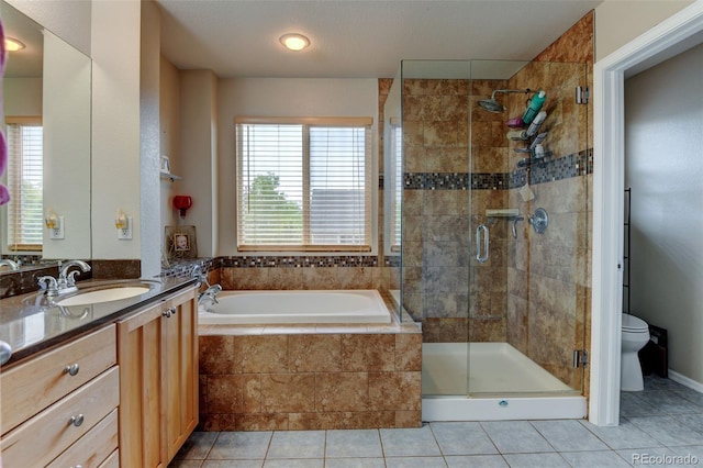 1995 E 166th Ave, Thornton, CO 80602 - bathroom featuring toilet, a garden tub, a stall shower, vanity, and tile patterned floors