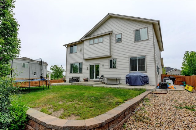 1995 E 166th Ave, Thornton, CO 80602 - rear view of house featuring a trampoline and a patio