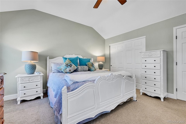 bedroom with light colored carpet, a ceiling fan, vaulted ceiling, and a closet