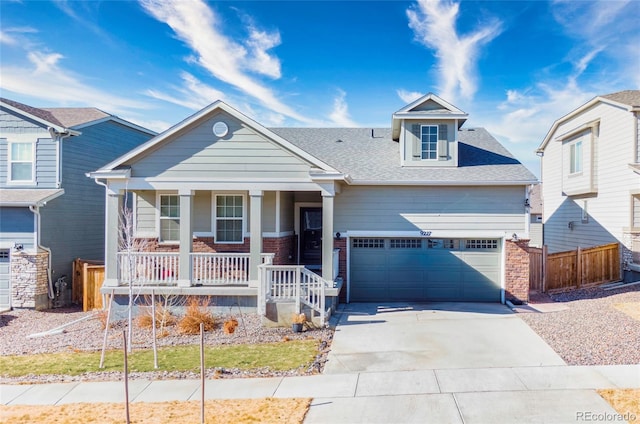 view of front of home with a garage and covered porch