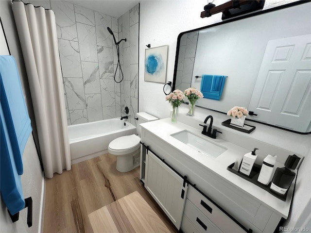 bathroom with toilet, shower / bath combo, wood finished floors, and vanity