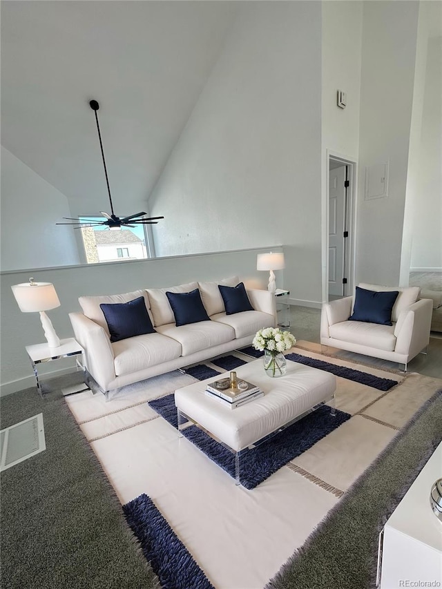 living room with high vaulted ceiling, baseboards, and a ceiling fan