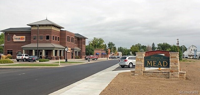 5425 County Rd 32 Unit 27, Mead, CO 80504 - view of asphalt street featuring sidewalks, street lighting, and curbs