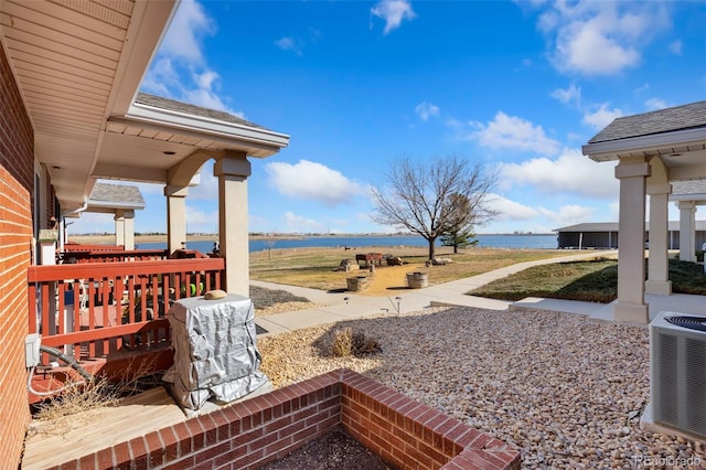 5425 County Rd 32 Unit 27, Mead, CO 80504 - view of yard featuring a water view, cooling unit, and a porch