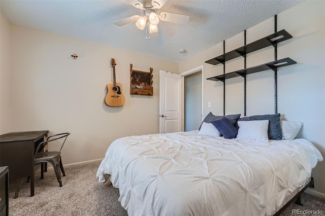 bedroom with a textured ceiling, carpet flooring, and ceiling fan