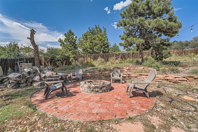 view of patio / terrace with an outdoor fire pit