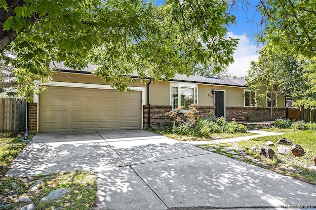 14797 E Temple Dr, Aurora, CO 80015 - single story home featuring brick siding, concrete driveway, and a garage
