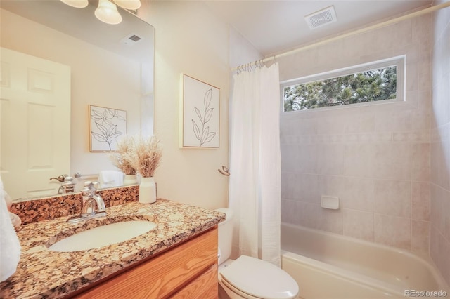 full bathroom featuring toilet, shower / bath combo, visible vents, and vanity