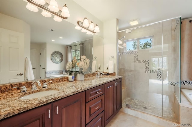 bathroom with a sink, a shower stall, and a bath