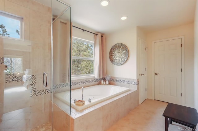 full bathroom with a stall shower, a garden tub, tile patterned floors, and recessed lighting