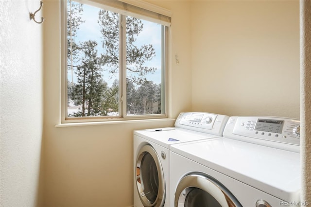 laundry area featuring laundry area and washer and clothes dryer