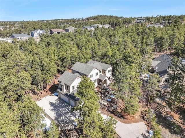 aerial view featuring a view of trees