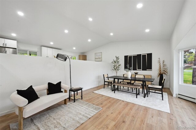 dining area with plenty of natural light, vaulted ceiling, light wood-type flooring, and recessed lighting