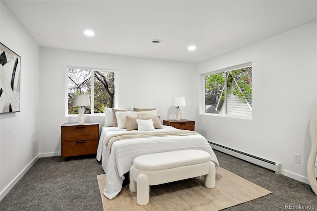 bedroom with baseboard heating, dark colored carpet, baseboards, and recessed lighting