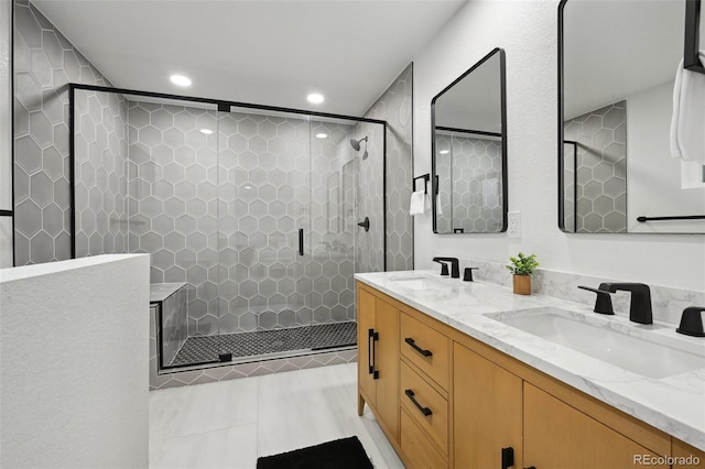bathroom with recessed lighting, a shower stall, double vanity, and tile patterned flooring