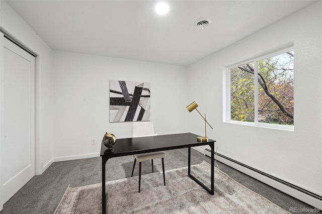 home office featuring baseboard heating, carpet floors, and baseboards