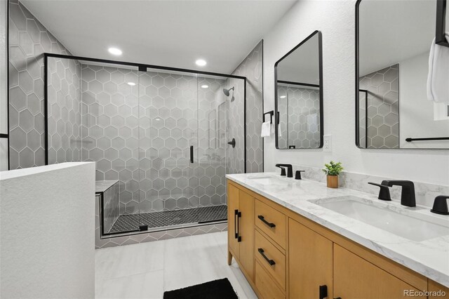 11351 Quivas Way, Denver, CO 80234 - full bath with double vanity, recessed lighting, a stall shower, and tile patterned flooring