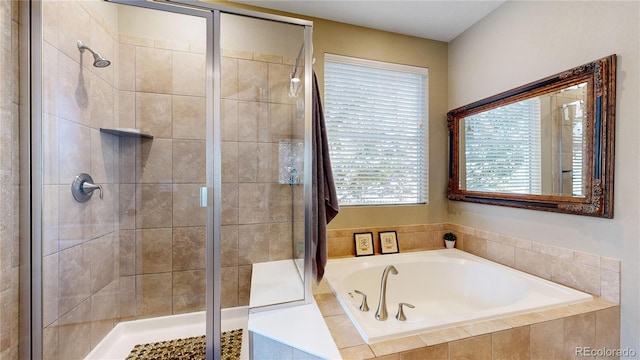 full bathroom with a garden tub and a shower stall