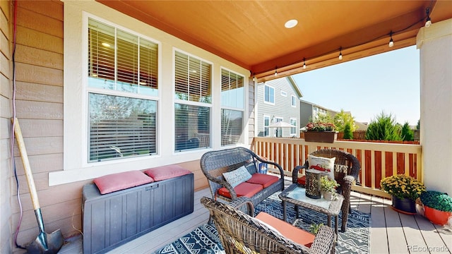 wooden deck featuring outdoor lounge area