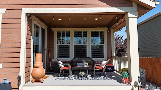 wooden terrace with a porch and outdoor lounge area