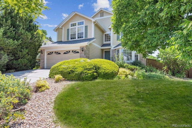 9823 Salford Ln, Highlands Ranch, CO 80126 - view of front facade featuring a garage, brick siding, and concrete driveway