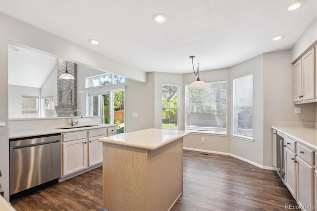 9823 Salford Ln, Highlands Ranch, CO 80126 - kitchen featuring dishwasher, light countertops, dark wood-style floors, a kitchen island, and recessed lighting