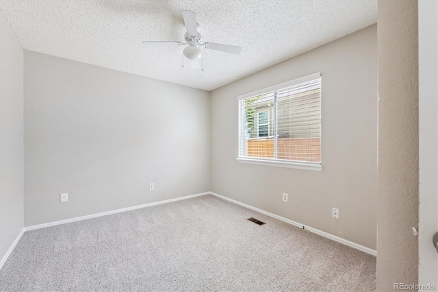 9823 Salford Ln, Highlands Ranch, CO 80126 - spare room with carpet flooring, a ceiling fan, and a textured ceiling