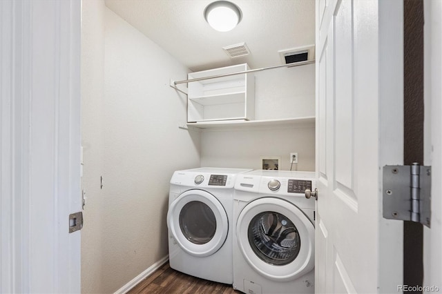 9823 Salford Ln, Highlands Ranch, CO 80126 - laundry room featuring washer and dryer and dark wood-style floors