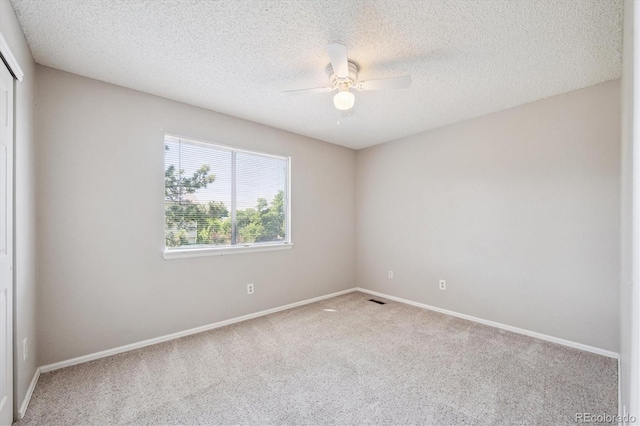 9823 Salford Ln, Highlands Ranch, CO 80126 - unfurnished room with carpet, ceiling fan, and a textured ceiling