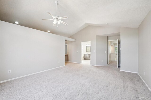 9823 Salford Ln, Highlands Ranch, CO 80126 - unfurnished living room featuring ceiling fan, carpet, and vaulted ceiling