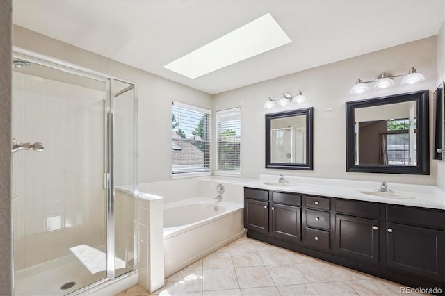 9823 Salford Ln, Highlands Ranch, CO 80126 - bathroom featuring a skylight, a shower stall, a bath, double vanity, and tile patterned flooring