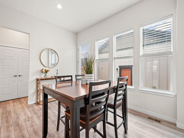 dining area featuring baseboards, recessed lighting, light wood-style floors, and visible vents