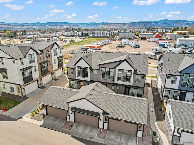 drone / aerial view with a mountain view and a residential view
