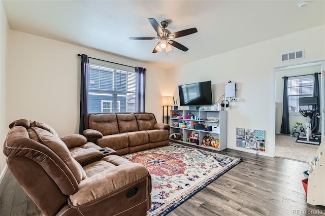 235 Yellowtail St, Bennett, CO 80102 - living room featuring visible vents, ceiling fan, plenty of natural light, and wood finished floors