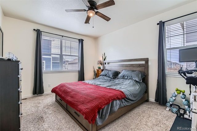 235 Yellowtail St, Bennett, CO 80102 - bedroom with baseboards, a ceiling fan, and carpet floors