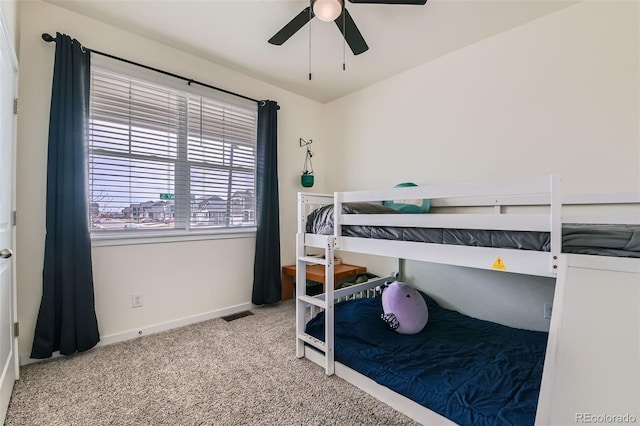 235 Yellowtail St, Bennett, CO 80102 - carpeted bedroom with visible vents, baseboards, and a ceiling fan
