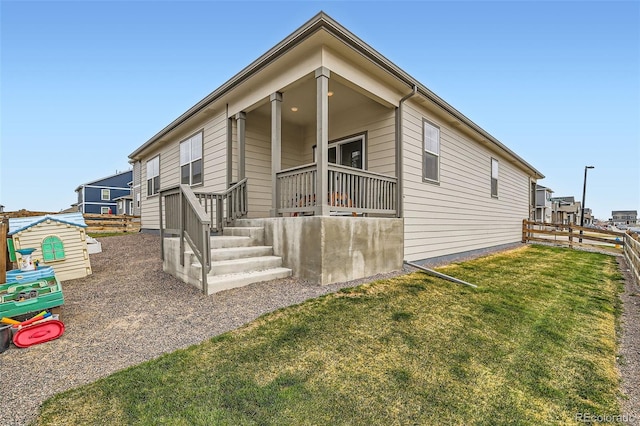 235 Yellowtail St, Bennett, CO 80102 - view of front of home featuring a front yard and fence