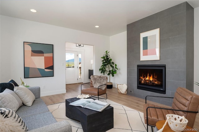 2101 Lupine Ln, Tabernash, CO 80478 - living area featuring wood finished floors, a fireplace, recessed lighting, and baseboards