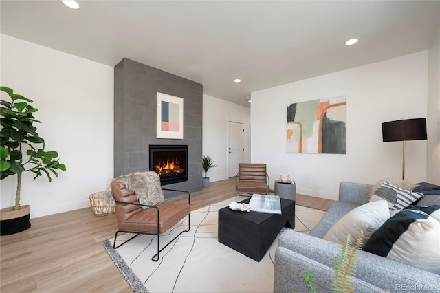 2101 Lupine Ln, Tabernash, CO 80478 - living room featuring baseboards, light wood-type flooring, a tile fireplace, and recessed lighting