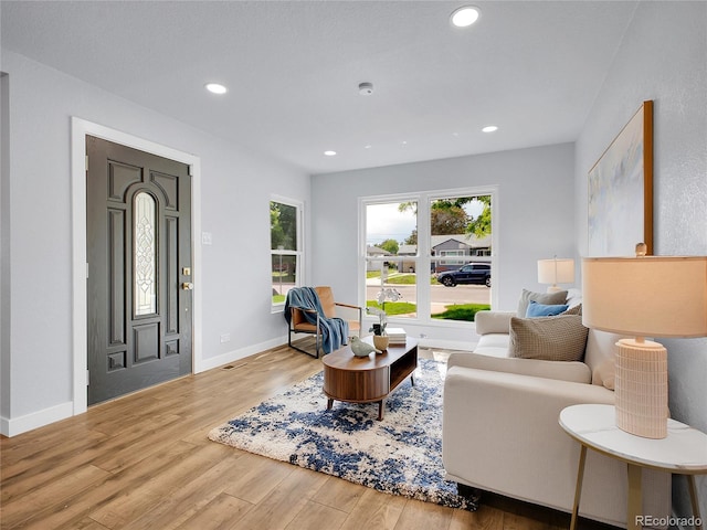 5152 Bryant St, Denver, CO 80221 - living area featuring wood finished floors, baseboards, and recessed lighting