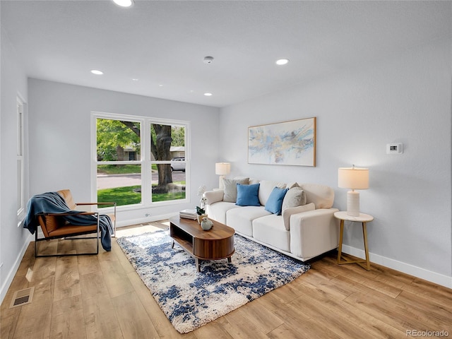 5152 Bryant St, Denver, CO 80221 - living room featuring wood finished floors, baseboards, and recessed lighting