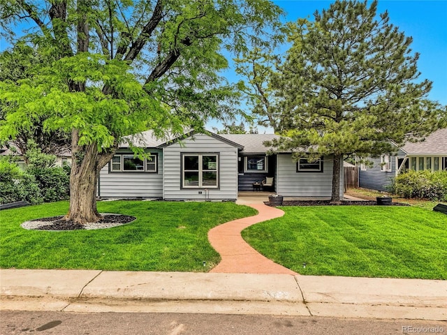 5152 Bryant St, Denver, CO 80221 - single story home featuring a front yard and roof with shingles