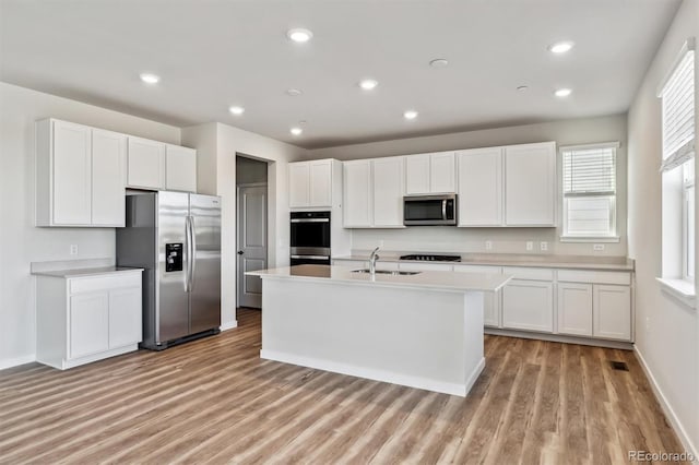 1397 Brookfield Pl, Erie, CO 80026 - kitchen featuring light countertops, stainless steel appliances, light wood-style flooring, and a sink