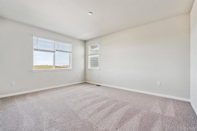 1397 Brookfield Pl, Erie, CO 80026 - spare room featuring baseboards and carpet